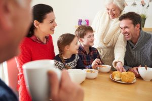 family-sitting-around-dinner-table