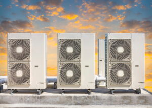 commercial-hvac-condensor-trio-against-sunset